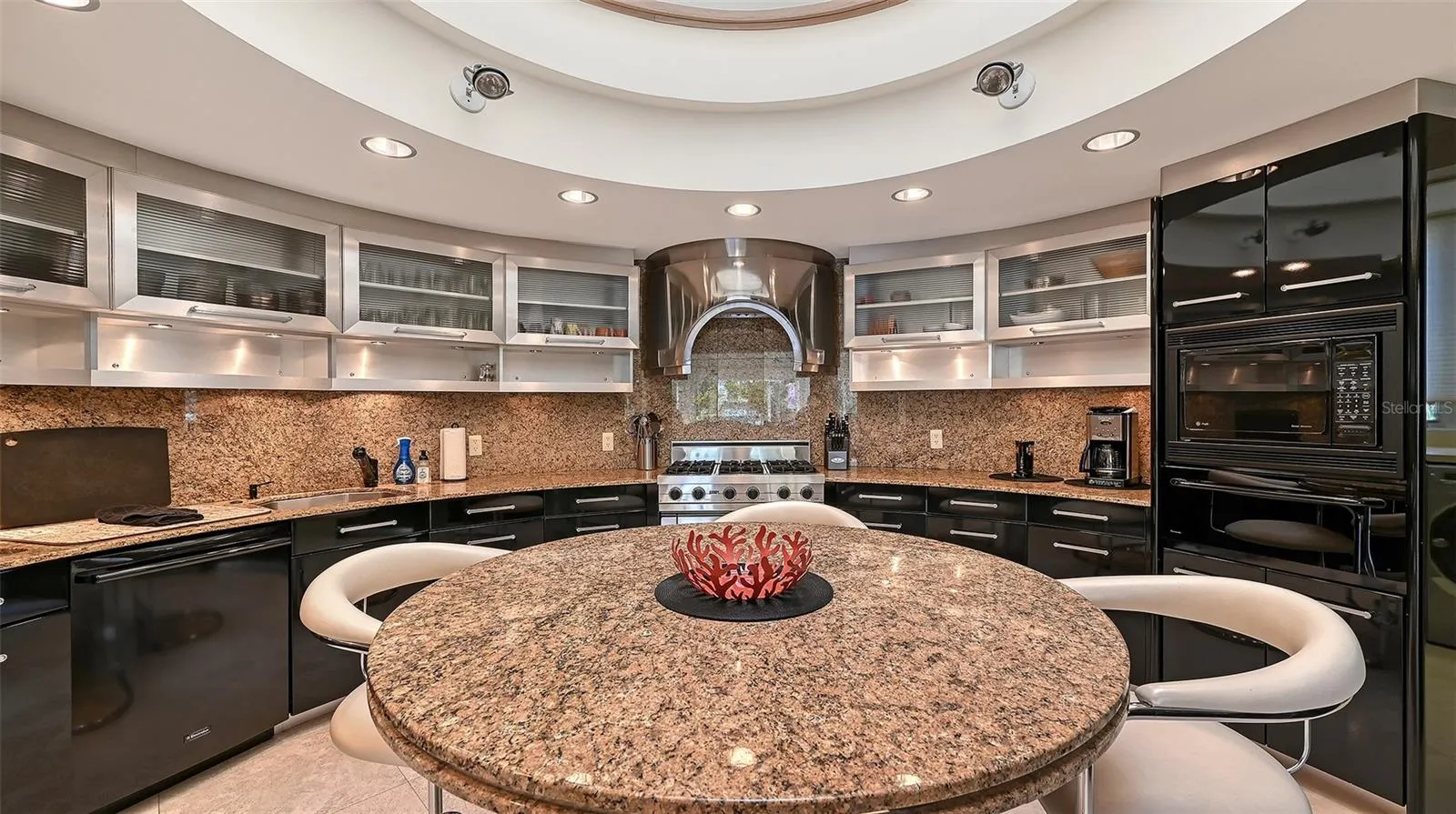 Viking professional natural gas range with a bespoke stainless steel vent hood