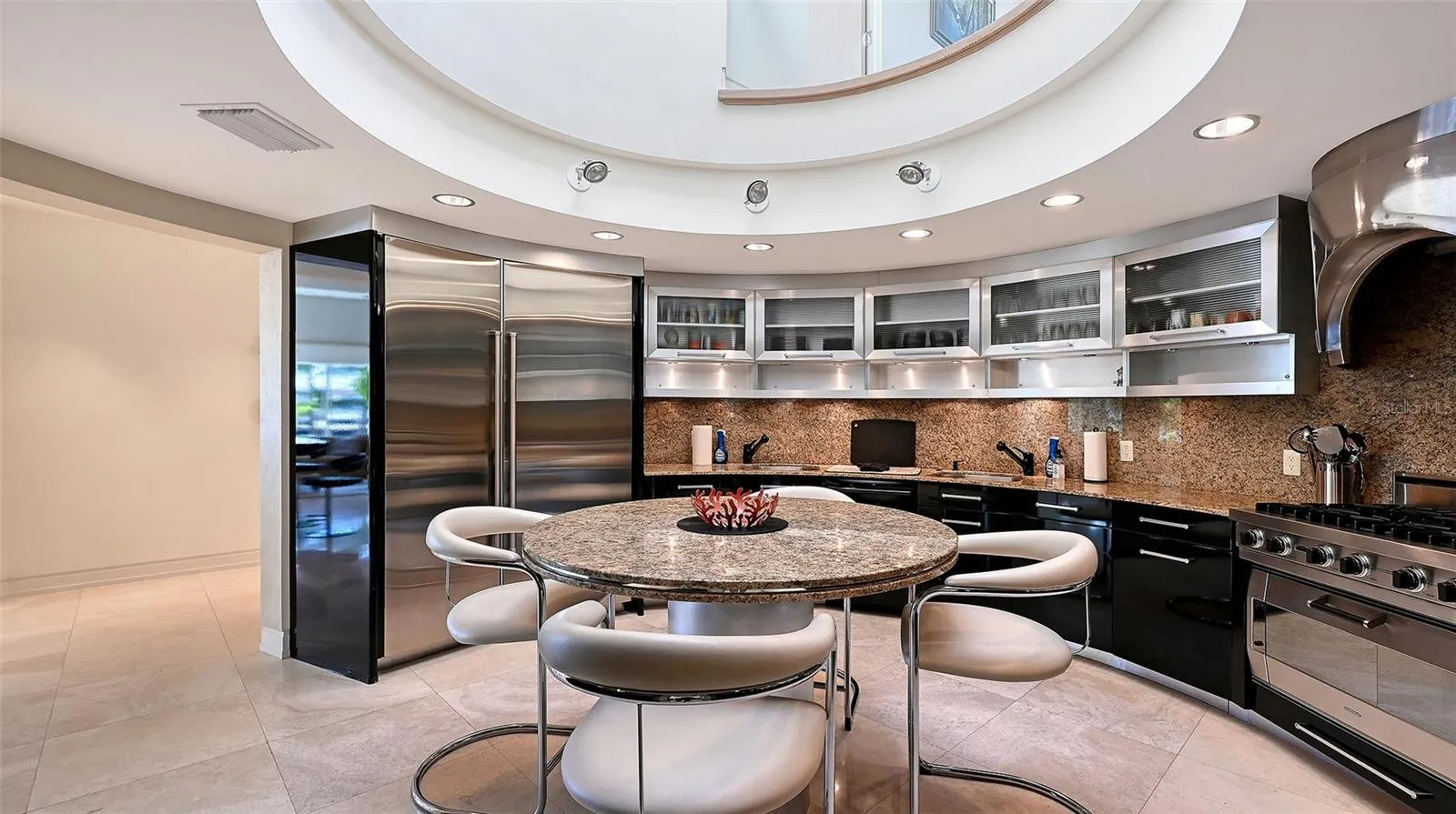 Kitchen with unique SubZero refigerator and freezer