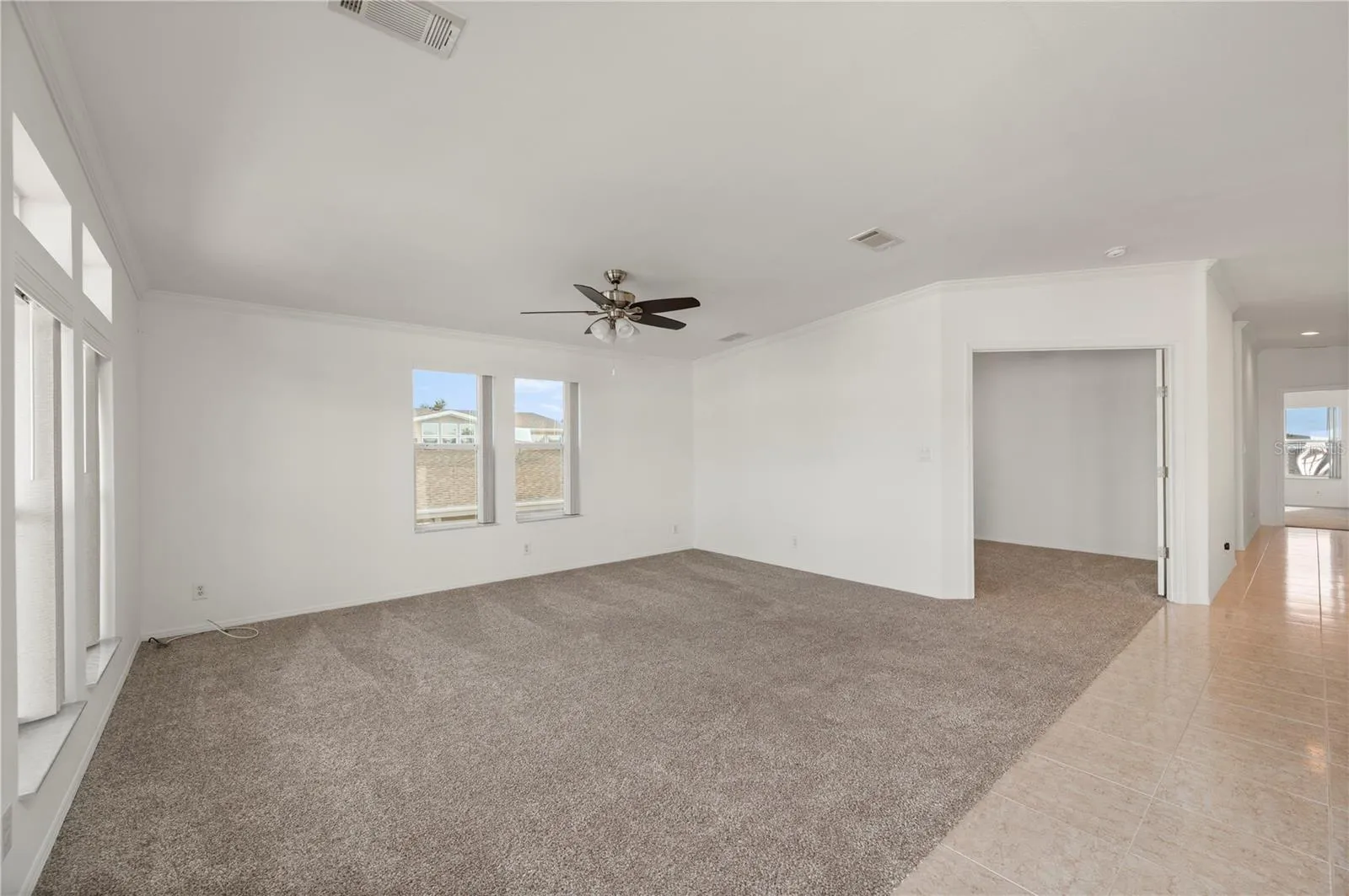 Living Room and Double door to BONUS room / office / 3rd bedroom... you decide!