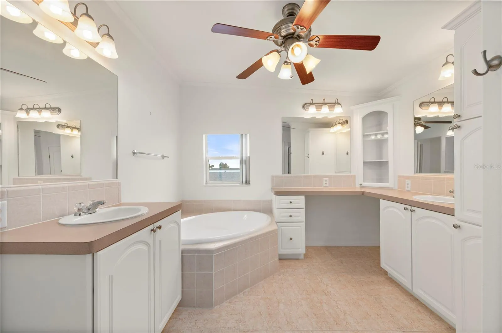 Main Bedroom's en suite bathroom dual sinks, makeup area, separate tub and shower, private w/c