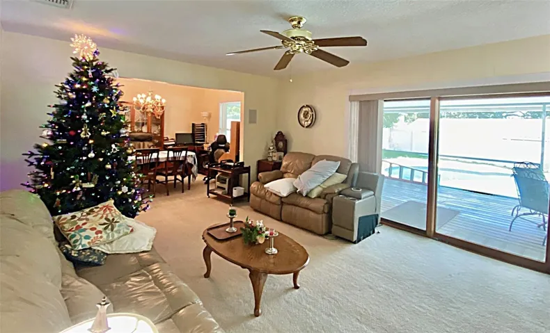 Formal dining room is open to living room creating a nice flow. The rectangles on wall either side of dining are built in speakers