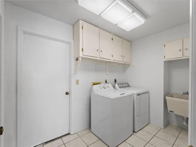Laundry room with door leading to the garage.