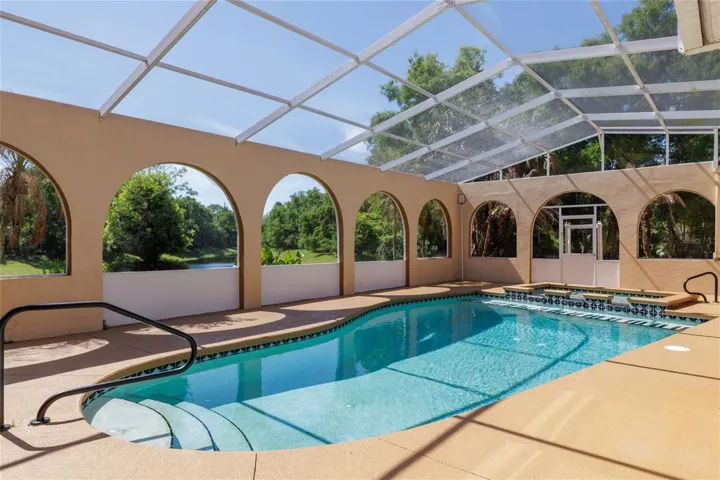 pool is enclosed within a screened lanai structure