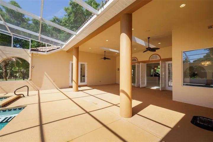 multiple entrances leading into the main house from swimming pool area
