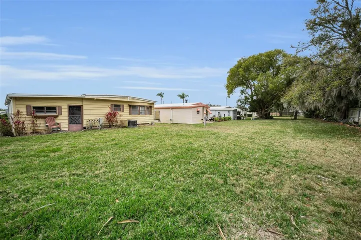 Hugh Yard to enjoy and for privacy all maintained by the community. Trees and fence in back