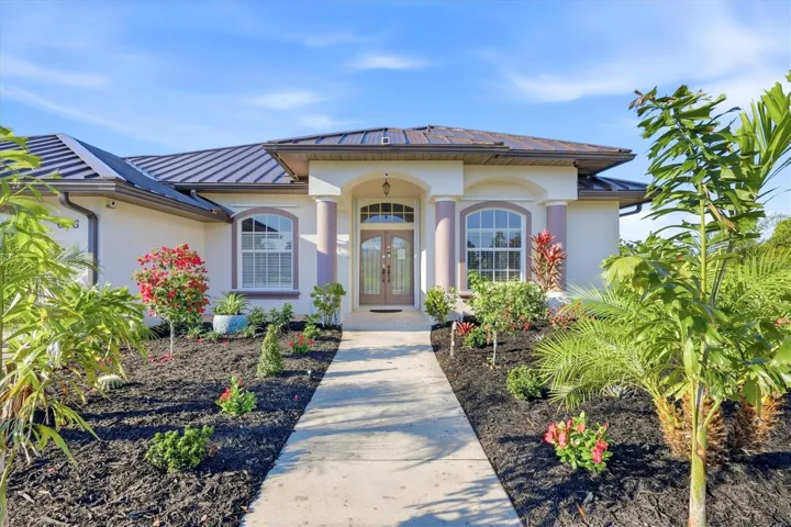 FRESH NEW TROPICAL LANDSCAPING  sets the tone for easy, laid-back Florida living at its finest.