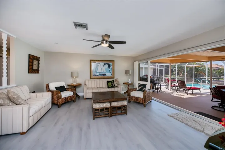 Spacious Formal Living Room with Sliding Doors and Pool Access