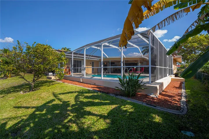 Solar Heated in Ground Pool with Screened in Pool Cage