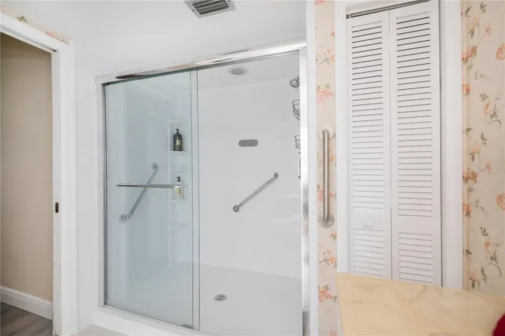 Walk in Glass Shower Door and Linen Closet