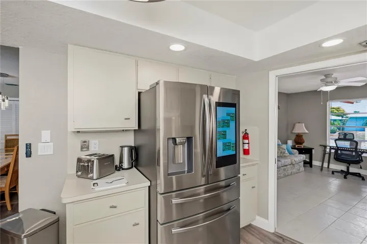 Chef Inspired Kitchen with Raised Recessed Lighting, Plenty of Cabinetry and Water Views from Sink