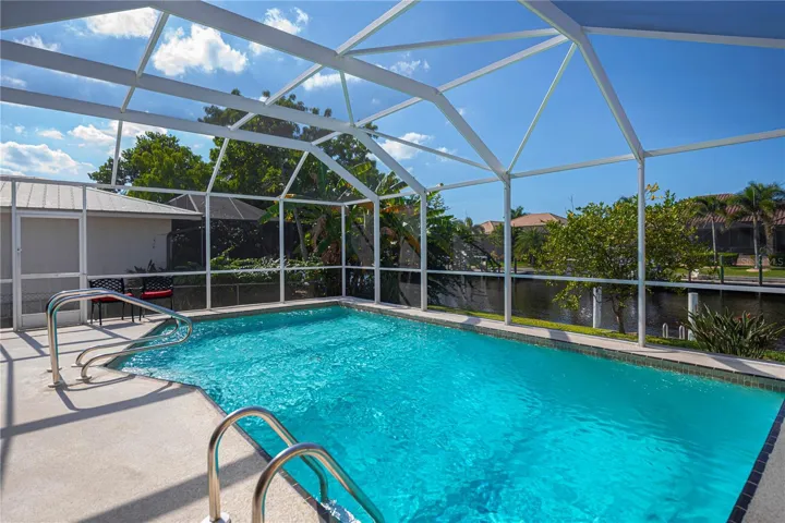 Solar Heated in Ground Pool with Screened in Pool Cage