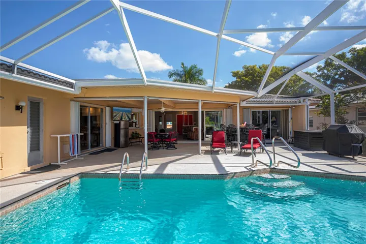 Solar Heated in Ground Pool with Screened in Pool Cage