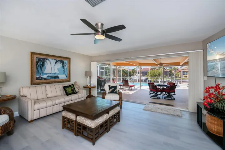 Spacious Formal Living Room with Sliding Doors and Pool Access