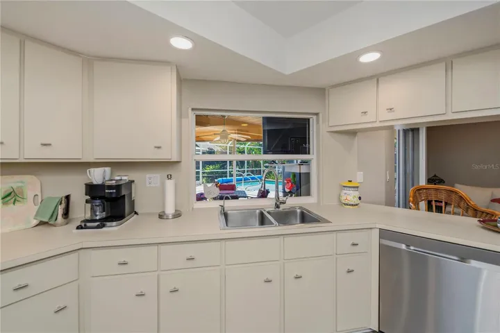 Chef Inspired Kitchen with Raised Recessed Lighting, Plenty of Cabinetry and Water Views from Sink