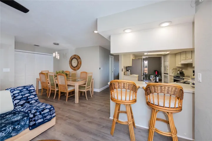 Breakfast Bar off Kitchen Next to Dining Area and Living Room