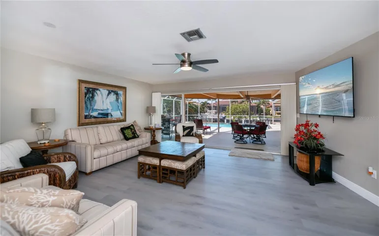 Spacious Formal Living Room with Sliding Doors and Pool Access