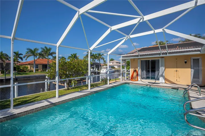 Solar Heated in Ground Pool with Screened in Pool Cage