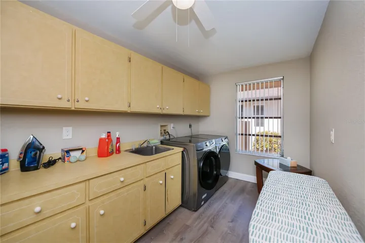 Inside Laundry with plenty of cabinetry