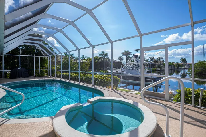 In Ground Heated Pool plus Spa with Screened In Enclosure