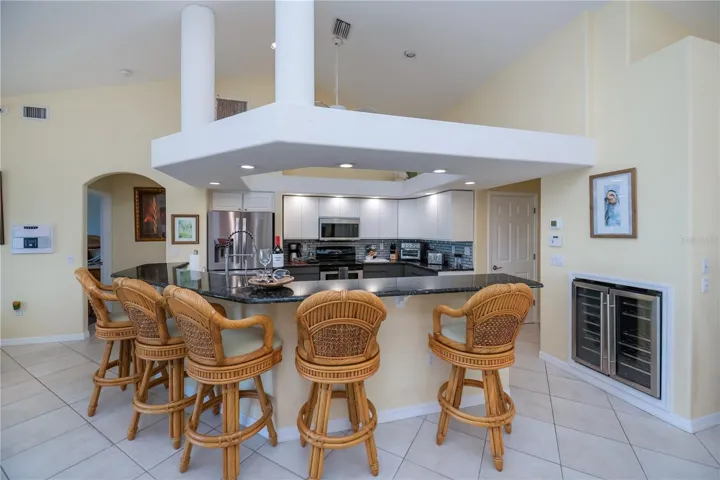 Breakfast Bar with Architectural Accents around Seating 5-6 Bar Stools