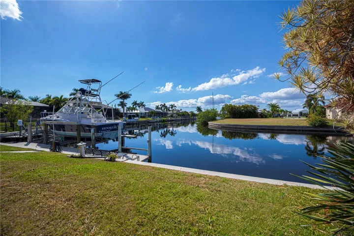 Backyard with Concrete Seawall, Dock and Boat Lift
