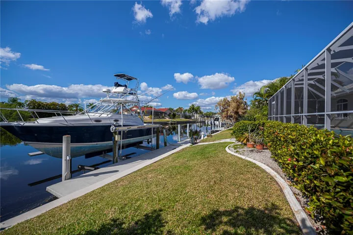 Backyard with Concrete Seawall, Dock and Boat Lift