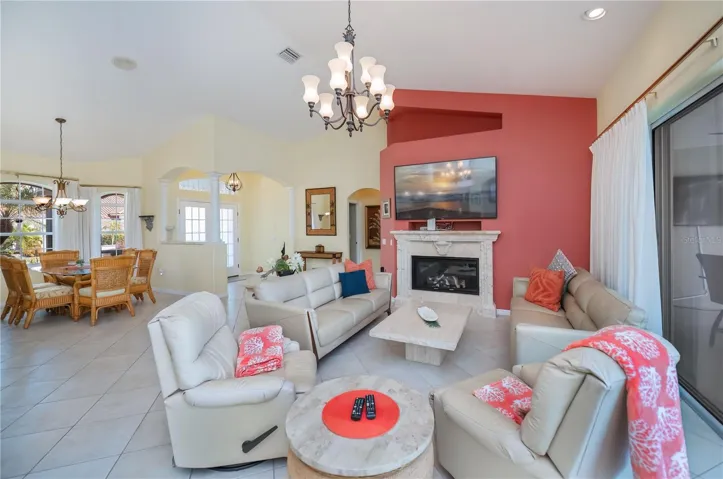 View of Font Entry from Living Room with High Cathedral Ceilings, and TV Area