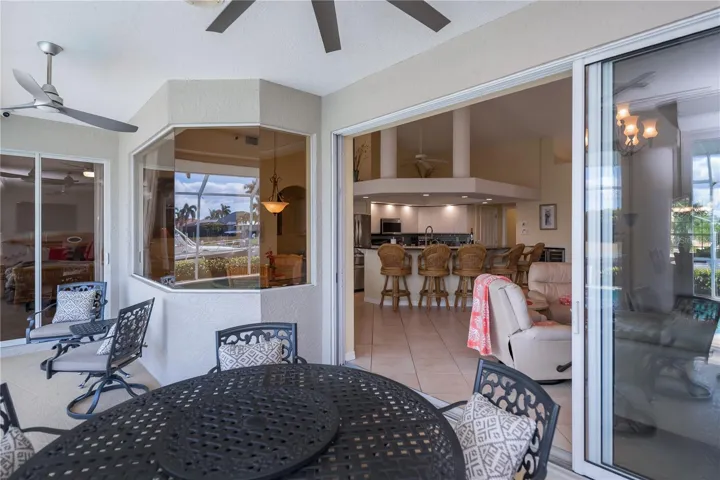 Covered Lanai with Waterviews, Tv Mounted on Wall, and In Ground Heated Pool plus Spa