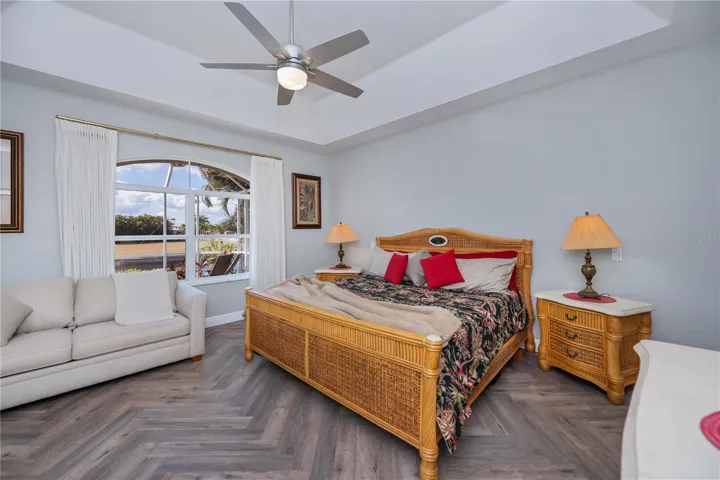 Primary Bedroom with Amazing Water Views, Lanai Access, Two Walk In Closets and On Suite Bathroom