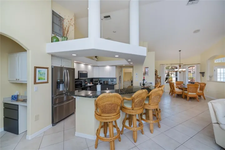 Breakfast Bar with Architectural Accents around Seating 5-6 Bar Stools