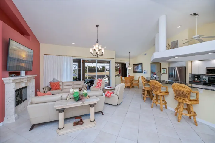 Living Room with High Cathedral Ceilings, Breakfast Bar and Two Dining Area