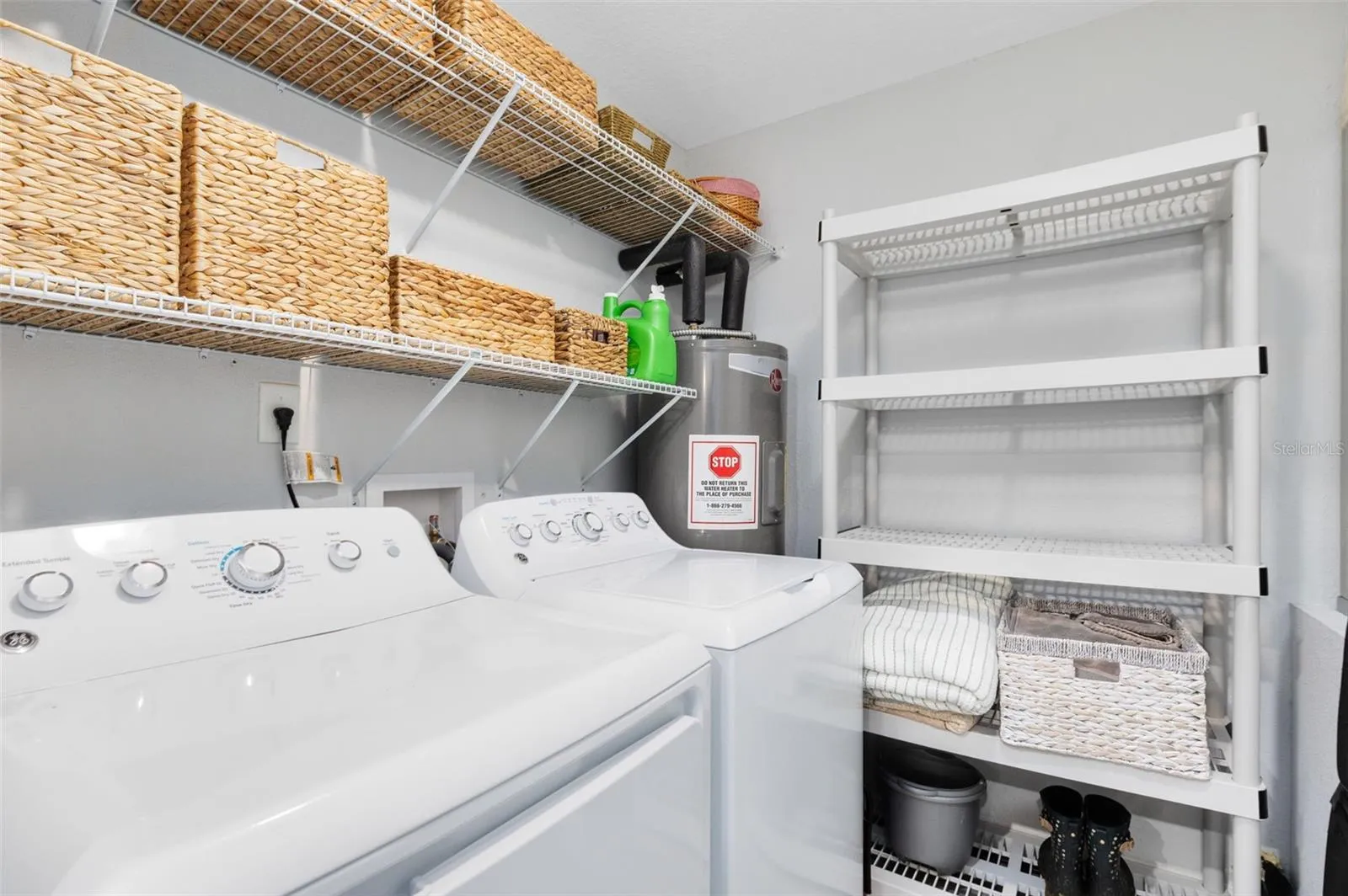 Laundry room, washer and dryer stay. Carport door entry/exit.