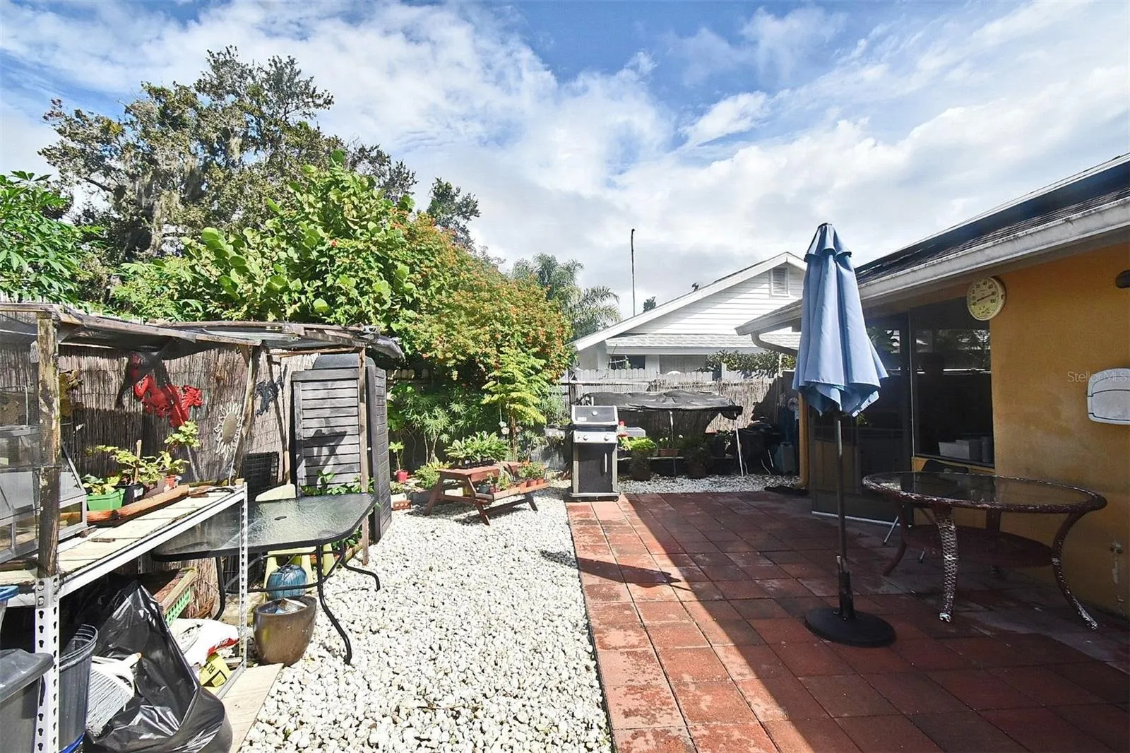 31 Chip Ct., spacious area in the back yard to enjoy grilling or potting your plants.  Storage Shed remains.