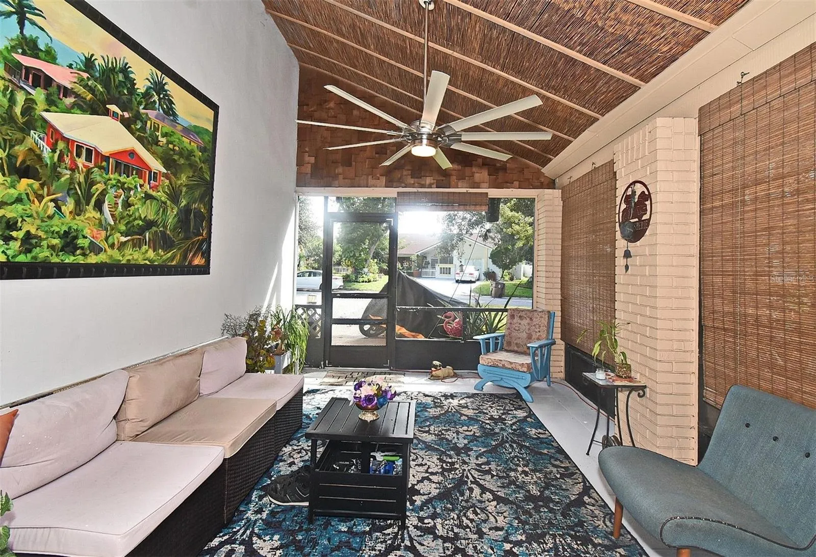 31 Chip Ct., Spacious front porch with a large fan to enjoy living in Florida year round.