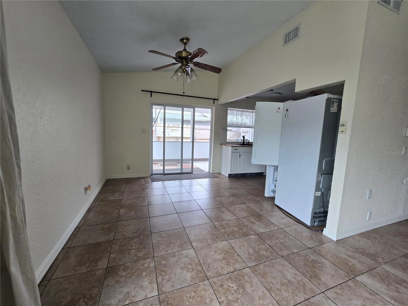 Living room with view of dining room