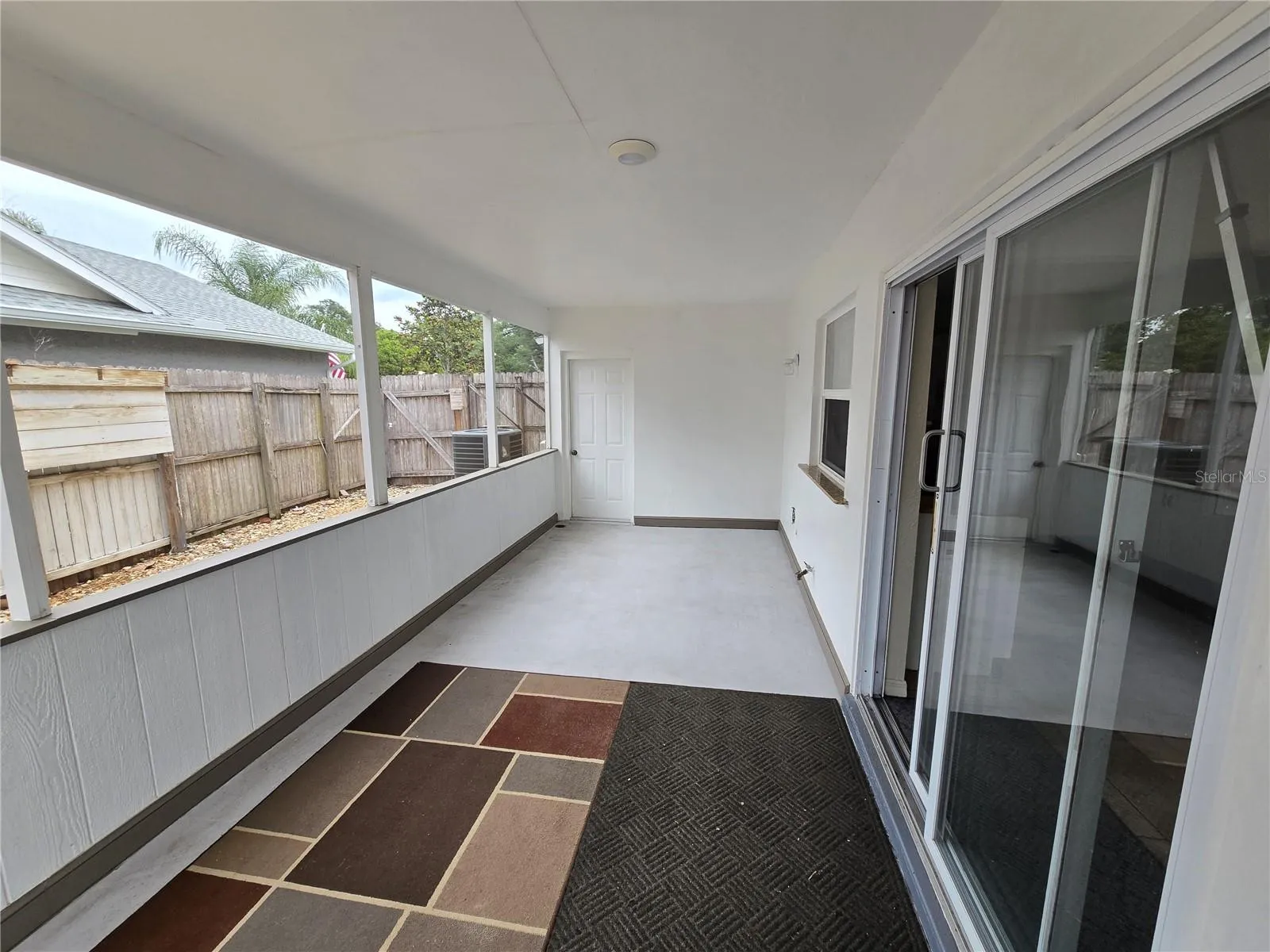 Side covered porch located off the kitchen