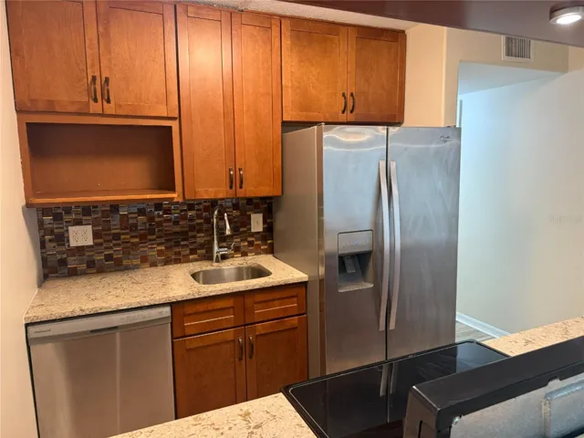 Great, glass backsplash, stainless steel appliances