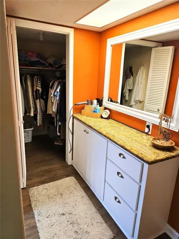 Dressing area and walk-in closet in the primary ensuite