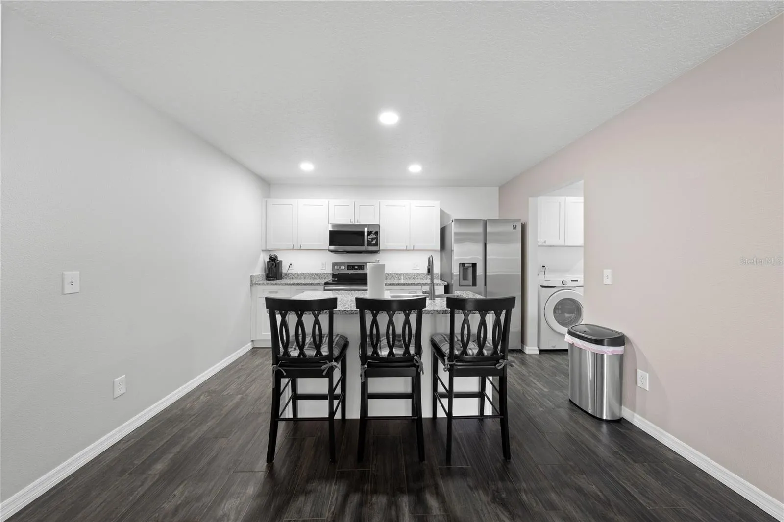 In-law suite view of kitchen rooms from dining area.