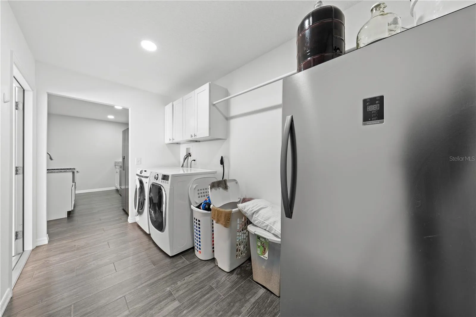 In-law suite laundry room going into the kitchen coming in from the garage door on the left.