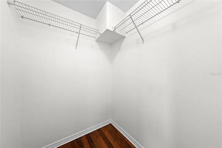 Main House Primary bedroom upstairs walk in closet.