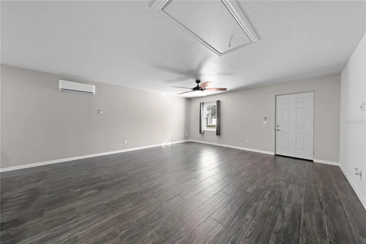 In-law suite view of living/dining rooms from kitchen. The door is the exterior front door.
