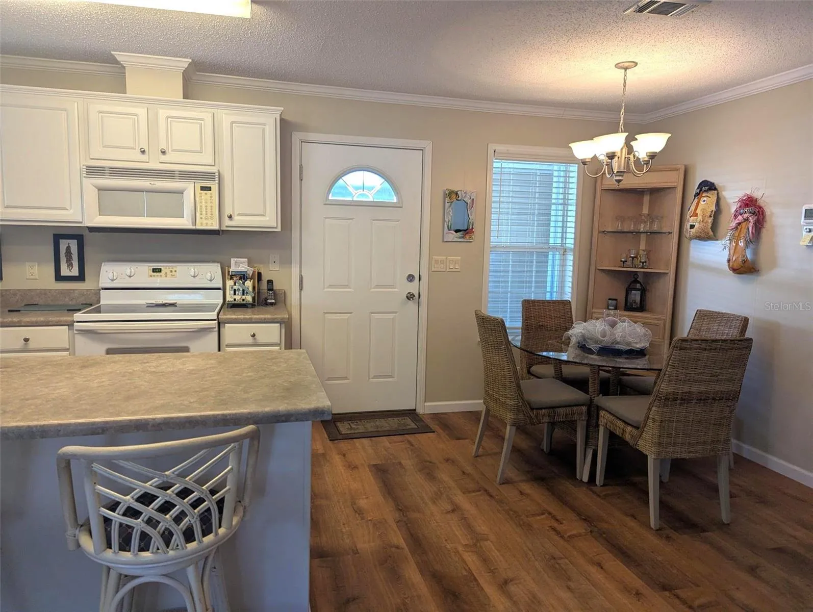 DINING AREA IN KITCHEN - OPEN FLOOR PLAN FLOWING FROM LIVING ROOM