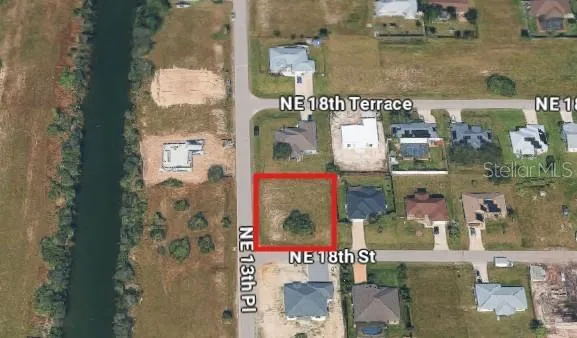 Partially cleared corner lot for sale in Cape Coral neighborhood!