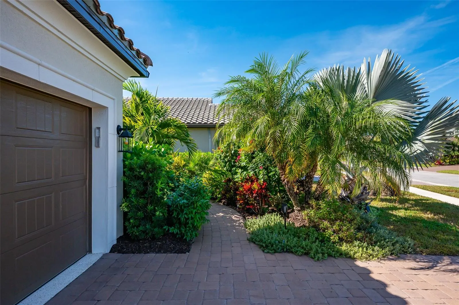 Lush landscape as you enter home.