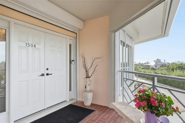 FULLY PROTECTED Front Entrance/Screened Porch: new screens, impact rated windows and doors with additional electric hurricane shutters. New panoramic screen, and new white aluminum porch enclosure and screen door!