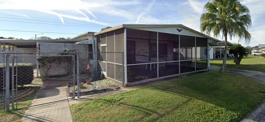 Front (Lot measures 68'x 77') Partially Fenced