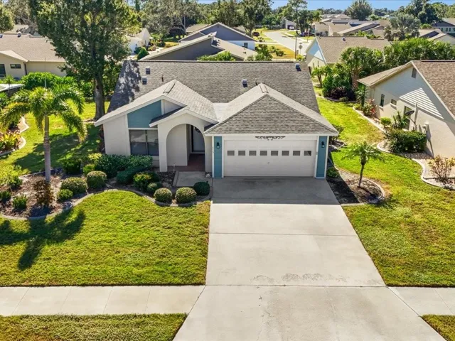 Elevated Shot of Front of Home, showing landscaping and large driveway