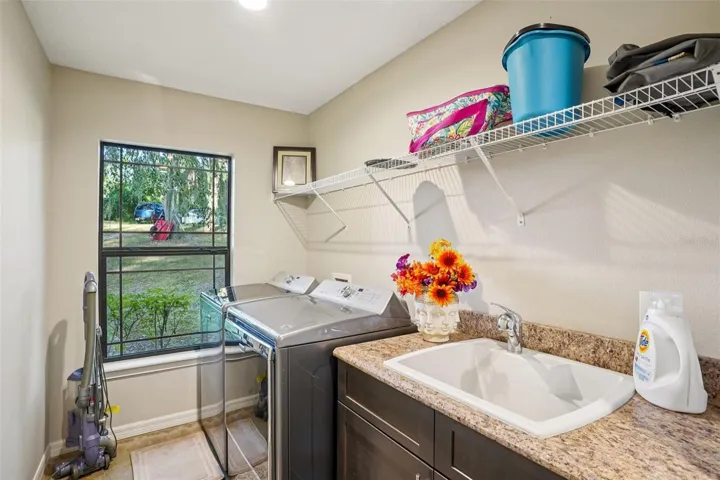 Laundry Room and Overflow Pantry off Kitchen