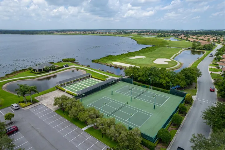 Lighted clubhouse tennis and shuffleboard courts